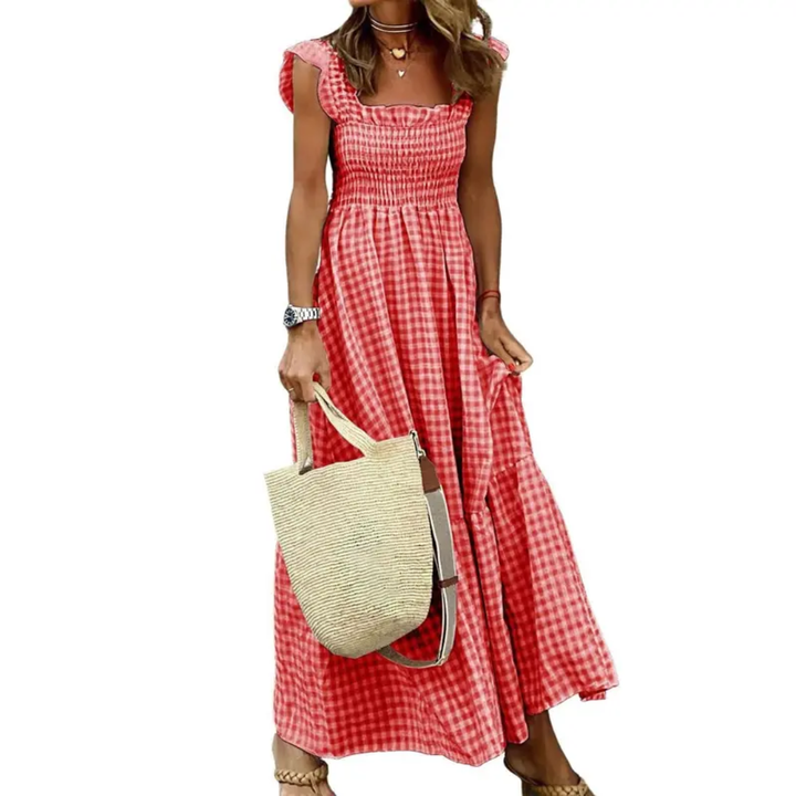 Comfortable women's maxi dress with smocked bodice & tiered skirt. Flowy design for casual, elegant summer style.