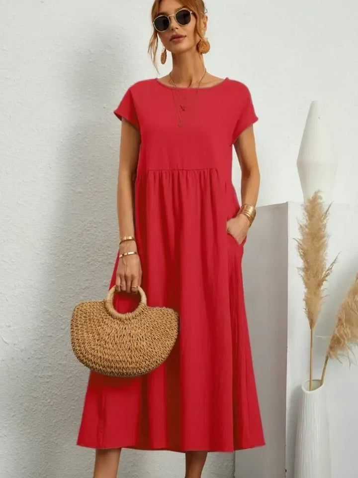 Women's smocked waist short sleeve maxi dress, flowy A-line, perfect for casual summer wear.