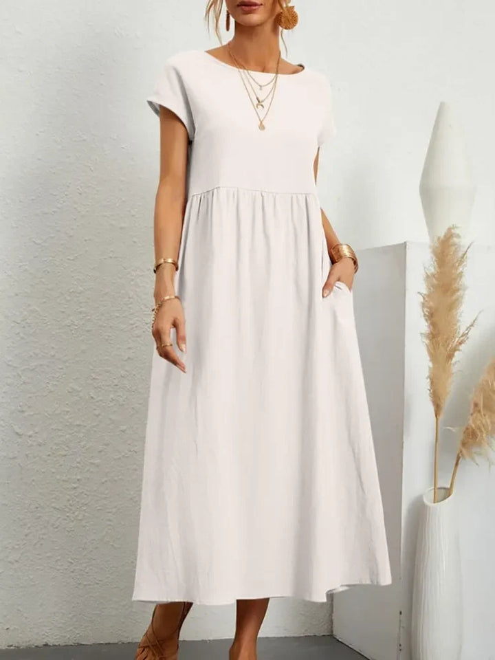 Comfortable women's short sleeve maxi dress with smocked waist, ideal for everyday & vacation.