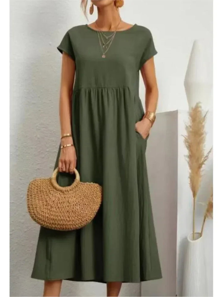 Elegant A-line smocked waist maxi dress for women, featuring short sleeves and a relaxed fit.