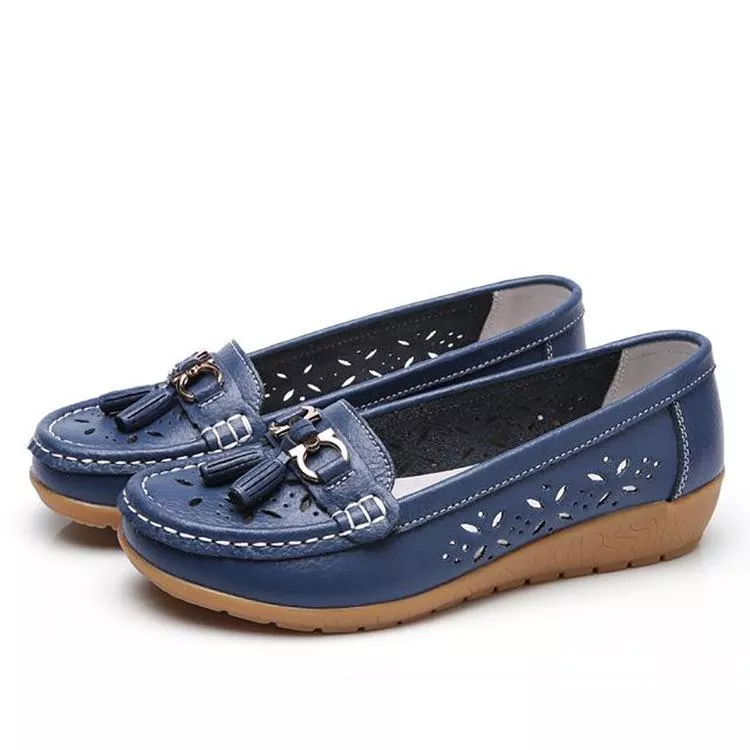 Side view of women's flat moccasin sandals, offering breathable comfort & casual summer style.