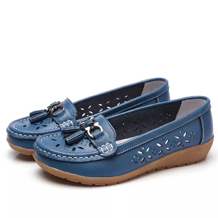 Woman wearing soft breathable moccasin sandals, enjoying comfortable summer walking.