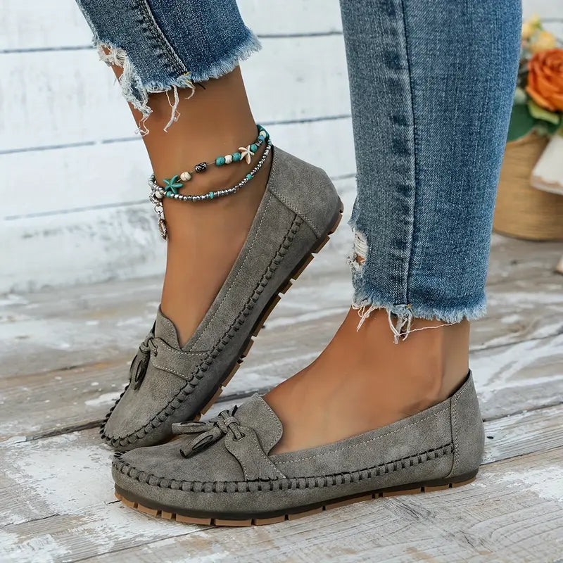 Navy blue women's slip-on loafers, stylish and soft for casual outings.