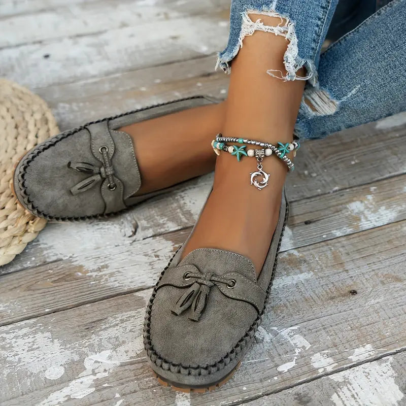 Comfortable slip-on women's loafers with cushioned insole & flexible sole.