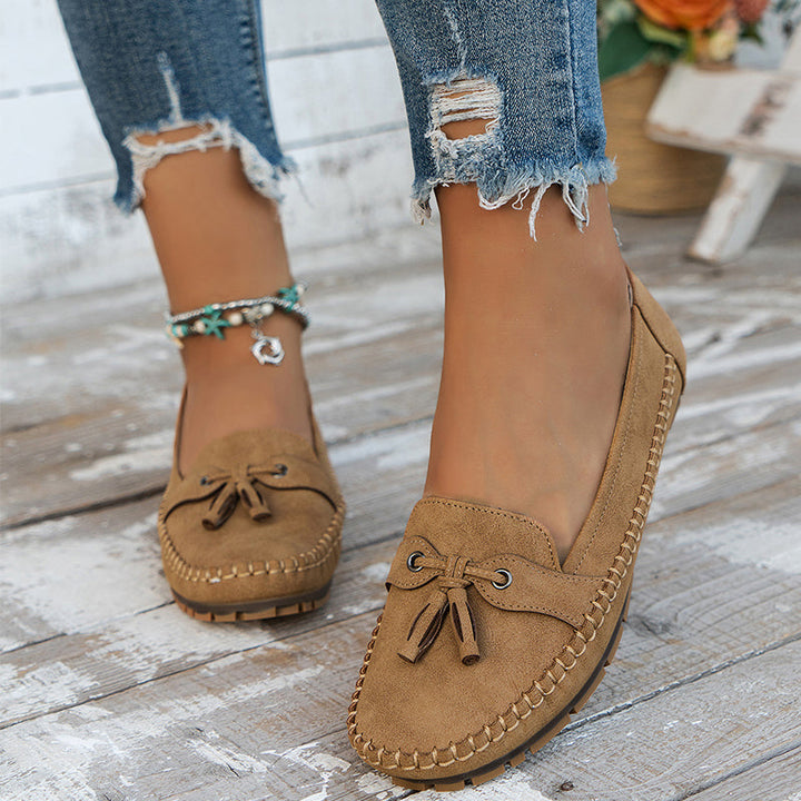 Vintage-inspired flat loafers offering posture support & soft comfort for women.