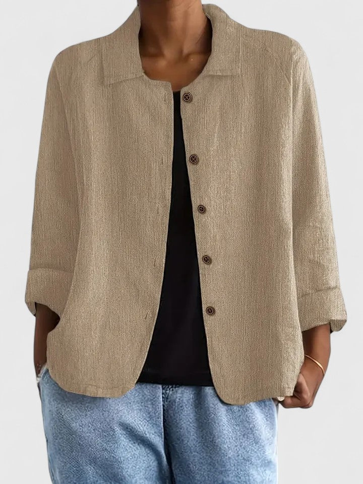 Close-up of women's sophisticated long-sleeve top fabric, highlighting elegant comfort.