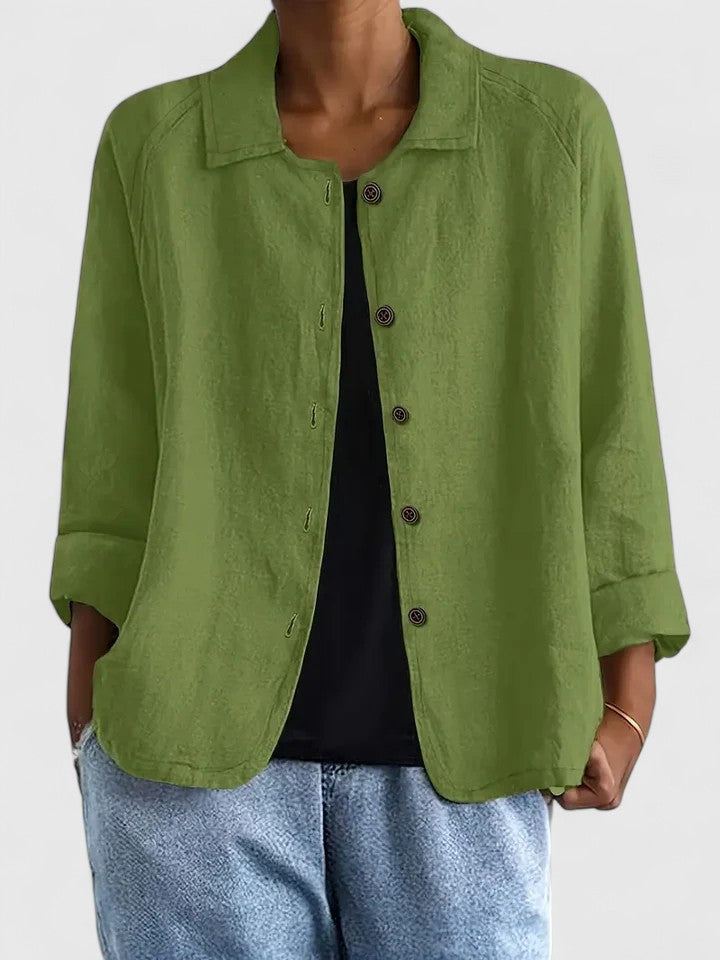 Woman wearing a stylish sophisticated top, an elegant & comfortable everyday fashion look.