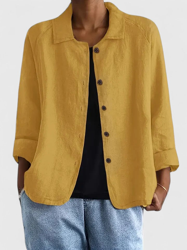 Fashionable women's sophisticated top, elegant & loose-fit for modern everyday style.