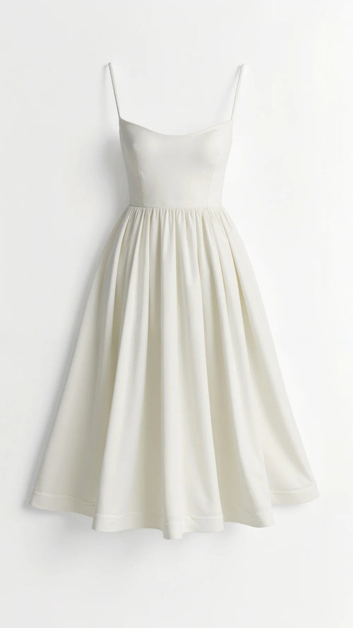 Flattering women's fit & flare midi dress featuring spaghetti straps, a scoop neck, and a feminine silhouette.
