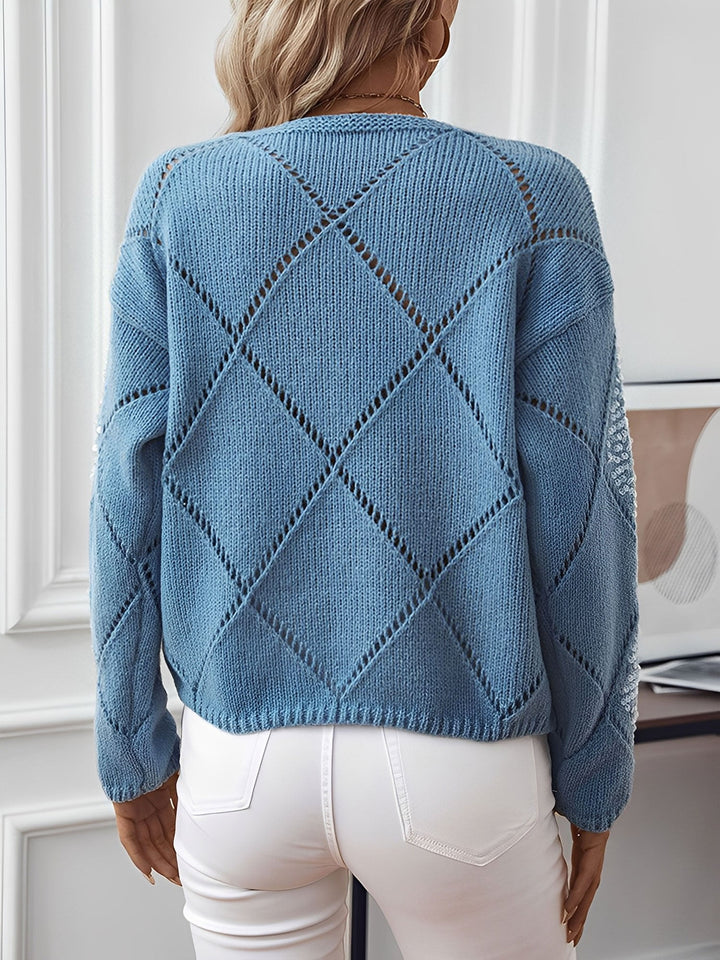 Relaxed fit women's sequin sweater with sparkling diamond pattern and comfortable crew neck.