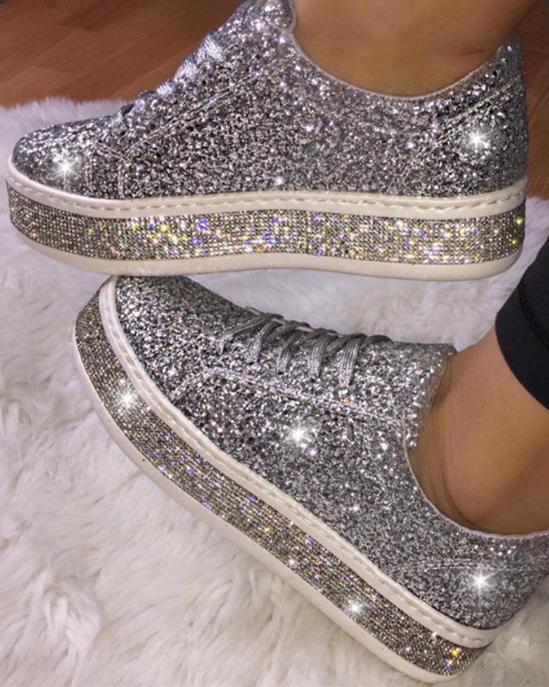 Women's sparkling glitter platform sneakers. Trendy casual footwear for chic, comfortable everyday style.