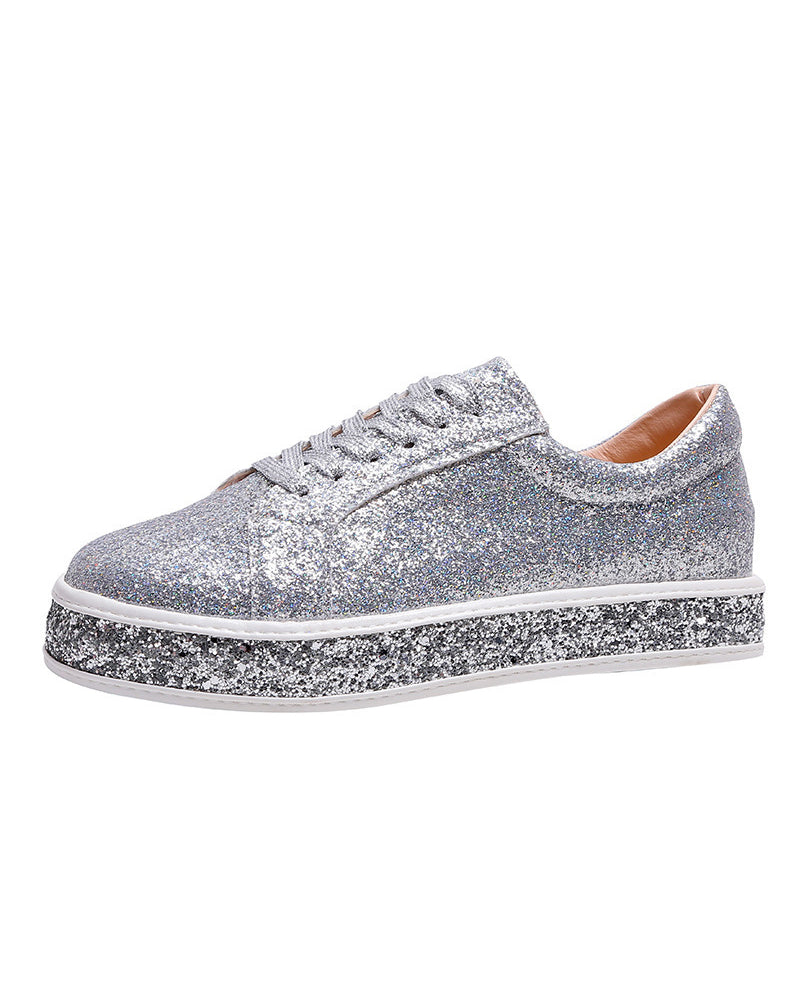 Sparkling glitter platform sneakers for women. Trendy casual footwear, offering a chic and comfortable fashion statement.