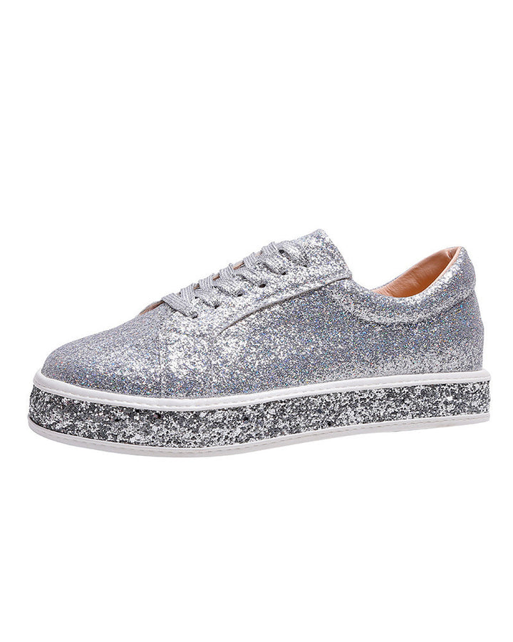 Sparkling glitter platform sneakers for women. Trendy casual footwear, offering a chic and comfortable fashion statement.