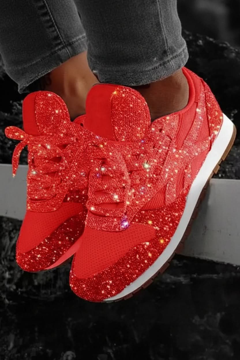 Studio shot of women's sparkling glitter sneakers, showcasing their vibrant sparkle and sleek design.