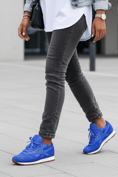 Detail of the sole & back of women's glitter sneakers, emphasizing comfort, durable design, & sparkling finish.