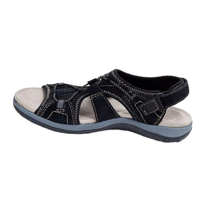Women's sporty comfort sandals in grey, against a backdrop of spring flowers
