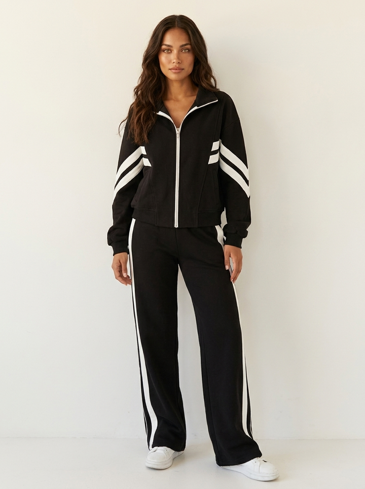 Comfortable women's loungewear tracksuit. Zip-up top & wide-leg bottoms, featuring a sporty contrast stripe.