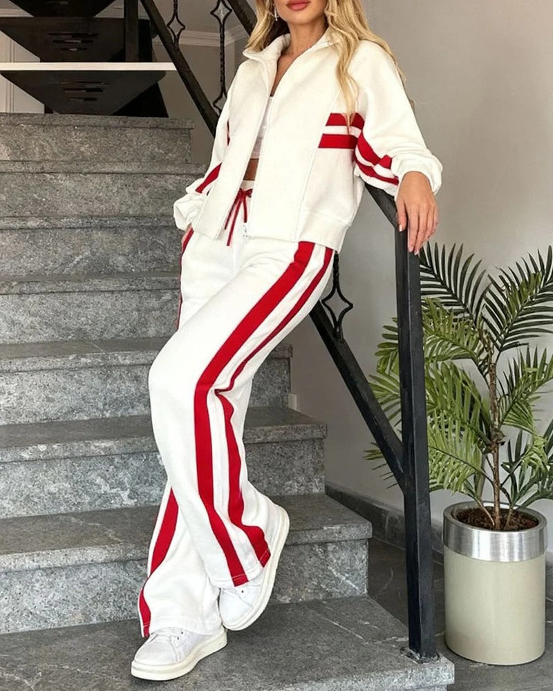 Casual women's athleisure tracksuit set. Zip-up jacket & wide-leg pants with trendy contrast stripe design.