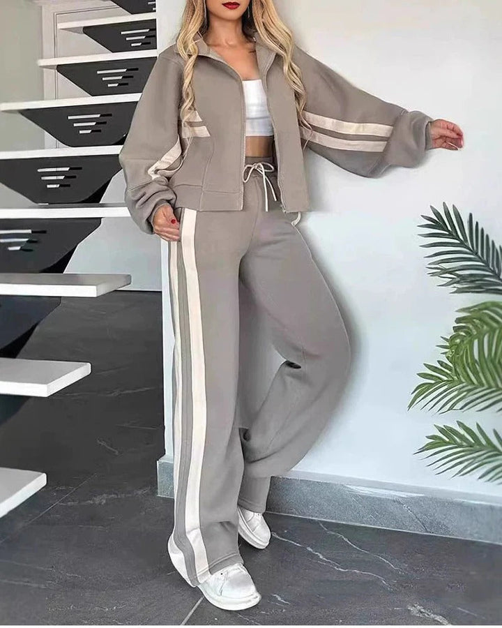 Women's zip-up tracksuit set. Sporty top & wide-leg pants, designed with contrast stripes for a chic loungewear outfit.