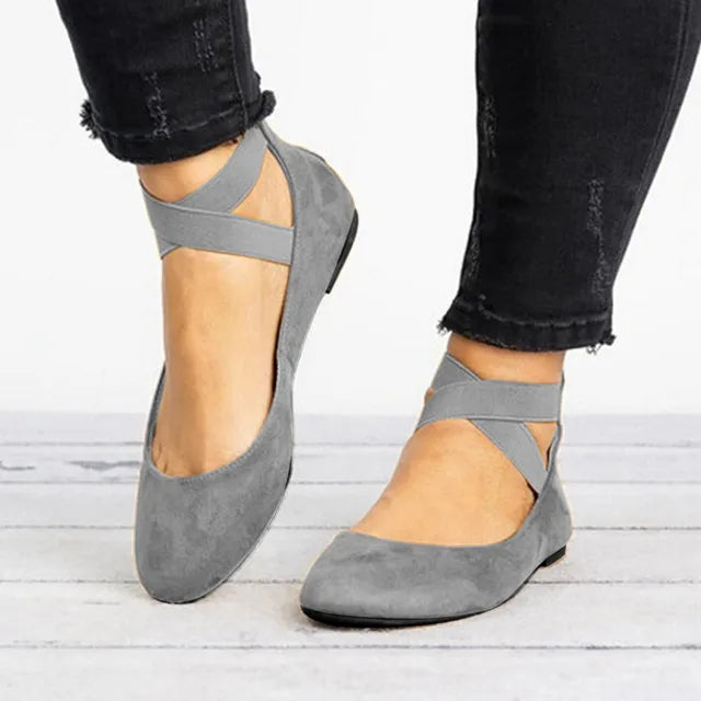 Stylish women's spring flats featuring a distinctive cross-strap, suitable for everyday elegance