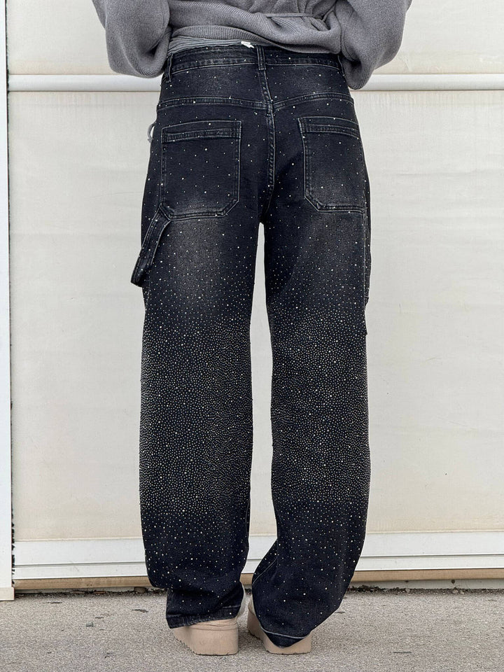 Side profile of women's flowy wide leg pants, highlighting the generous cut and elegant drape.