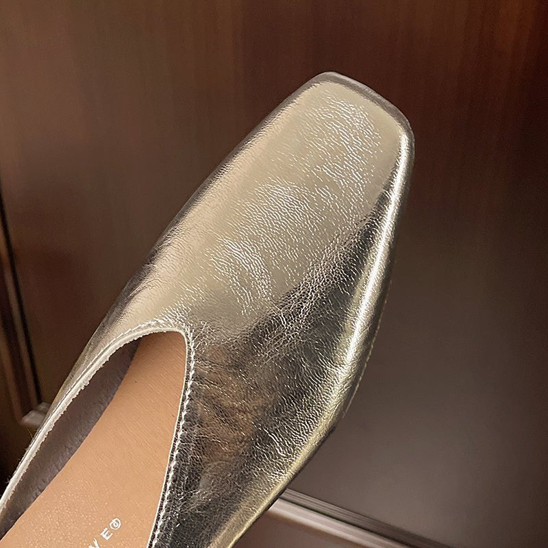 Modern slip-on women's flats with a distinctive square toe, ideal for sophisticated spring looks.