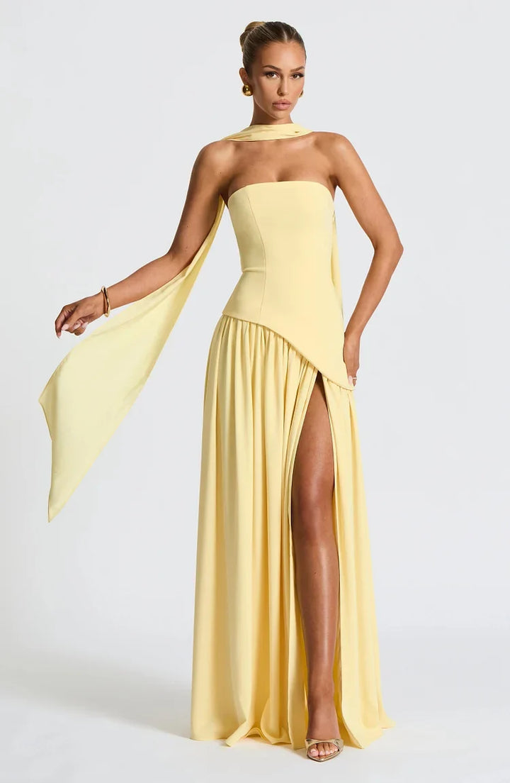 Elegant women's strapless maxi dress with asymmetric hem. Perfect formal, cocktail, or evening attire.