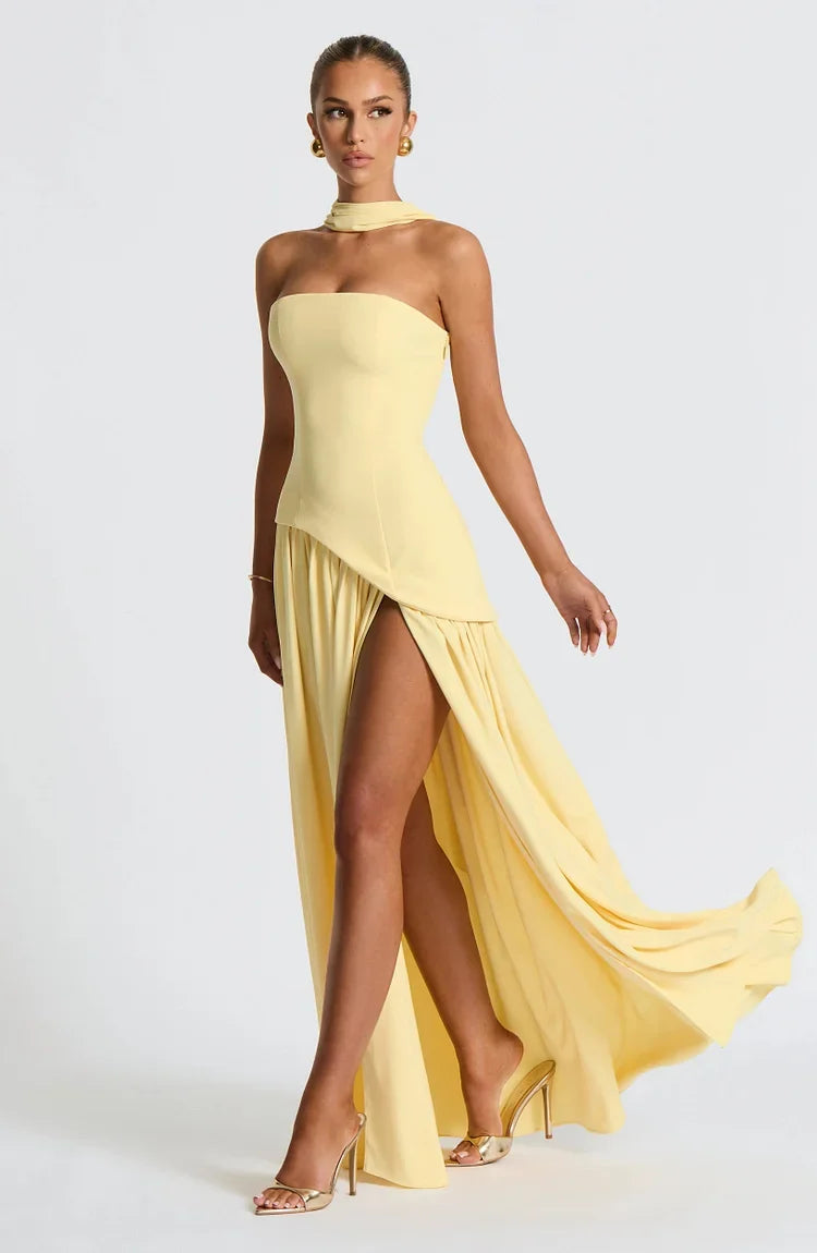 Chic women's strapless long dress, featuring a stylish asymmetric hem. Ideal for special occasion fashion.