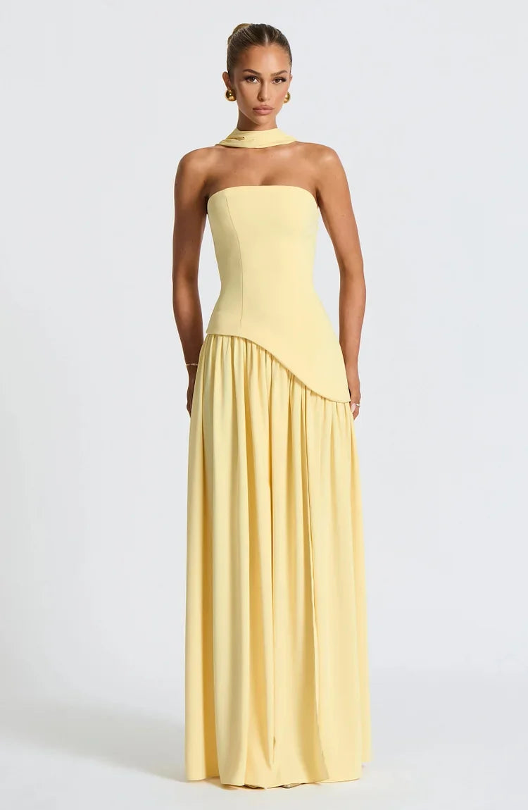 Fashionable women's strapless asymmetric maxi dress. Elegant evening, formal, and cocktail attire.