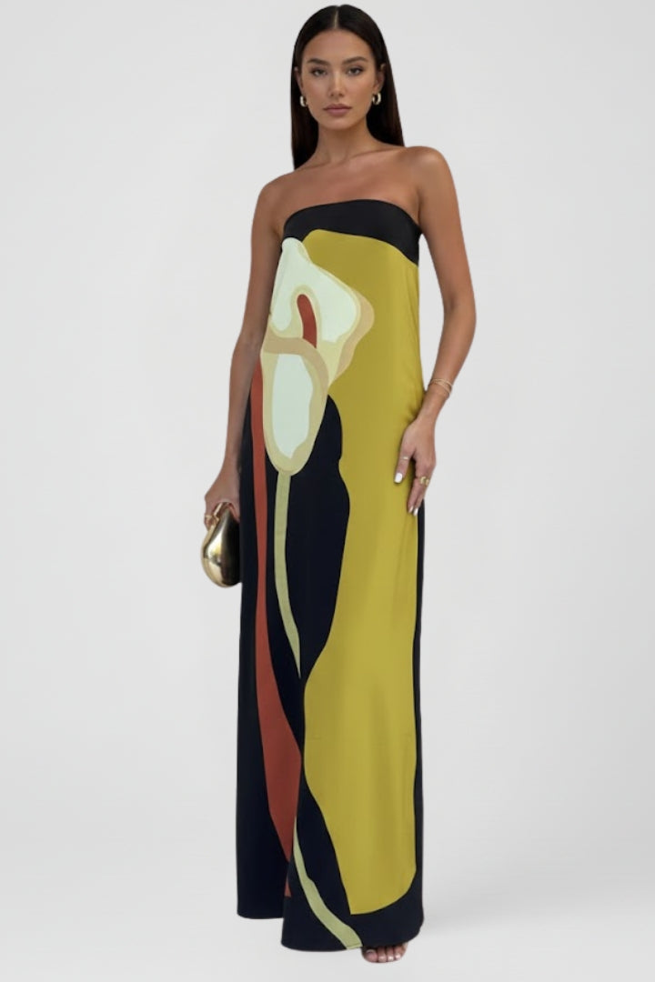 Elegant flowing strapless maxi dress for women, featuring a unique colorful abstract print.