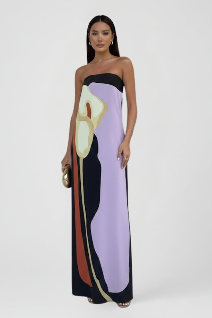 Women's elegant strapless maxi dress, featuring a striking abstract print for summer casual occasions.