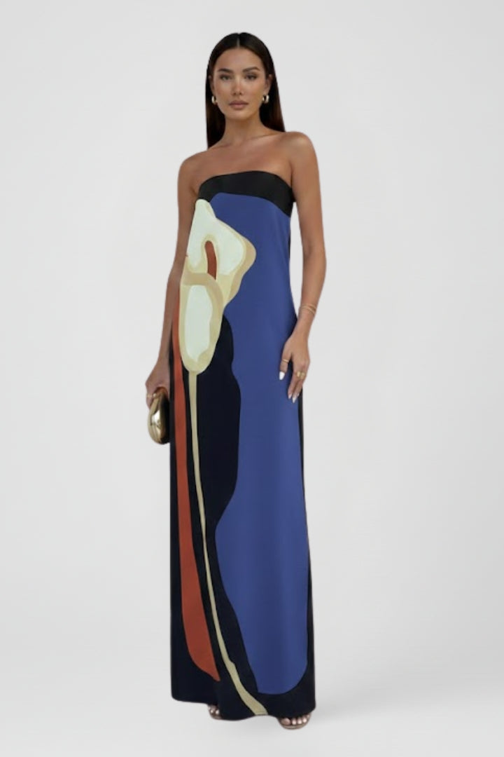 Flowing women's strapless maxi dress with a unique abstract design, perfect for beach and vacation.