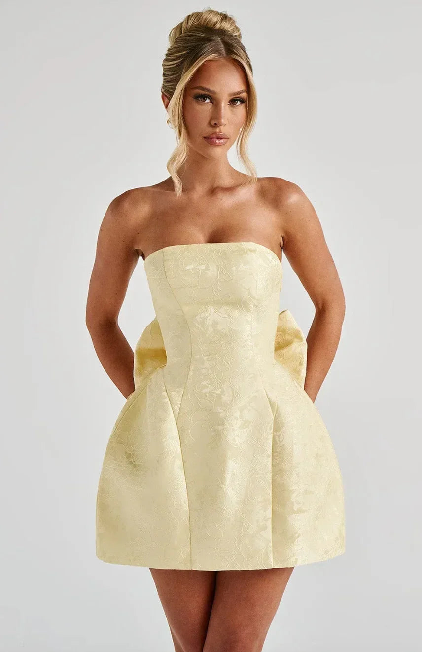 Women's strapless mini dress with a large statement bow on the back. Perfect party or cocktail dress.