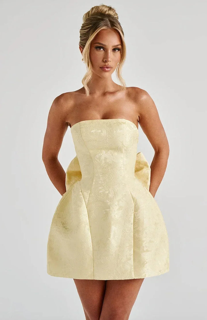 Women's strapless mini dress with a large statement bow on the back. Perfect party or cocktail dress.