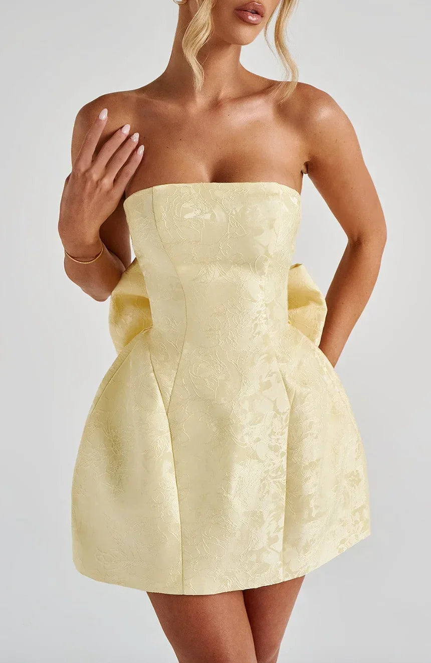 Chic women's strapless party dress with a unique statement bow back detail. A must-have cocktail dress.