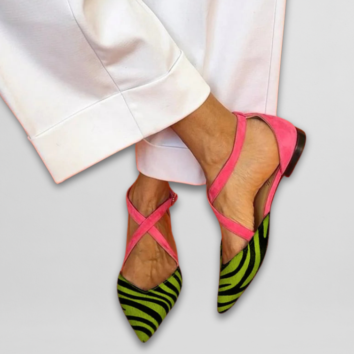Chic women's zebra print & fuchsia strappy ballerina flats, showing elegant ankle straps and comfortable design.