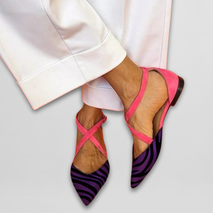 Elegant women's strappy ballerina flats in eye-catching zebra print & vibrant fuchsia, offering comfort & style.