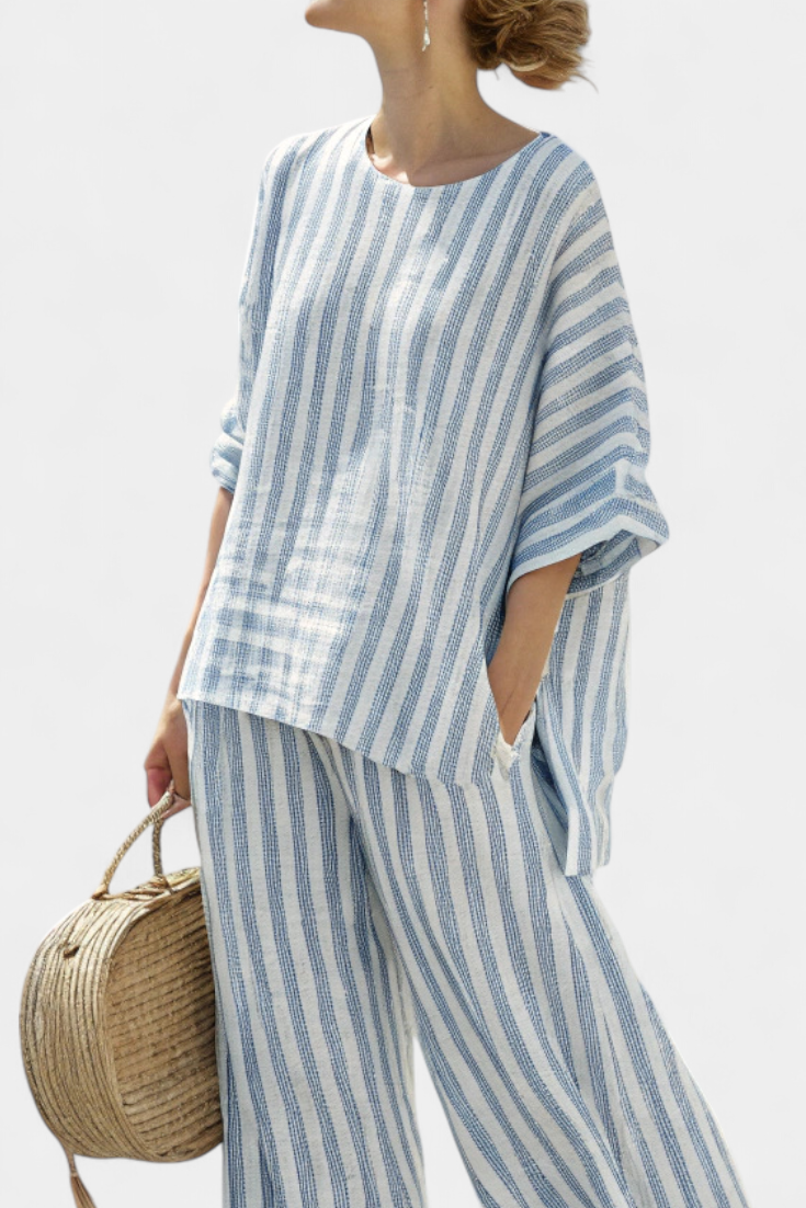 Comfortable women's two-piece set with a striped batwing sleeve top and oversized wide leg pants.
