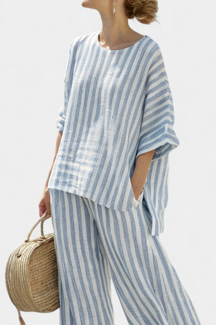 Comfortable women's two-piece set with a striped batwing sleeve top and oversized wide leg pants.