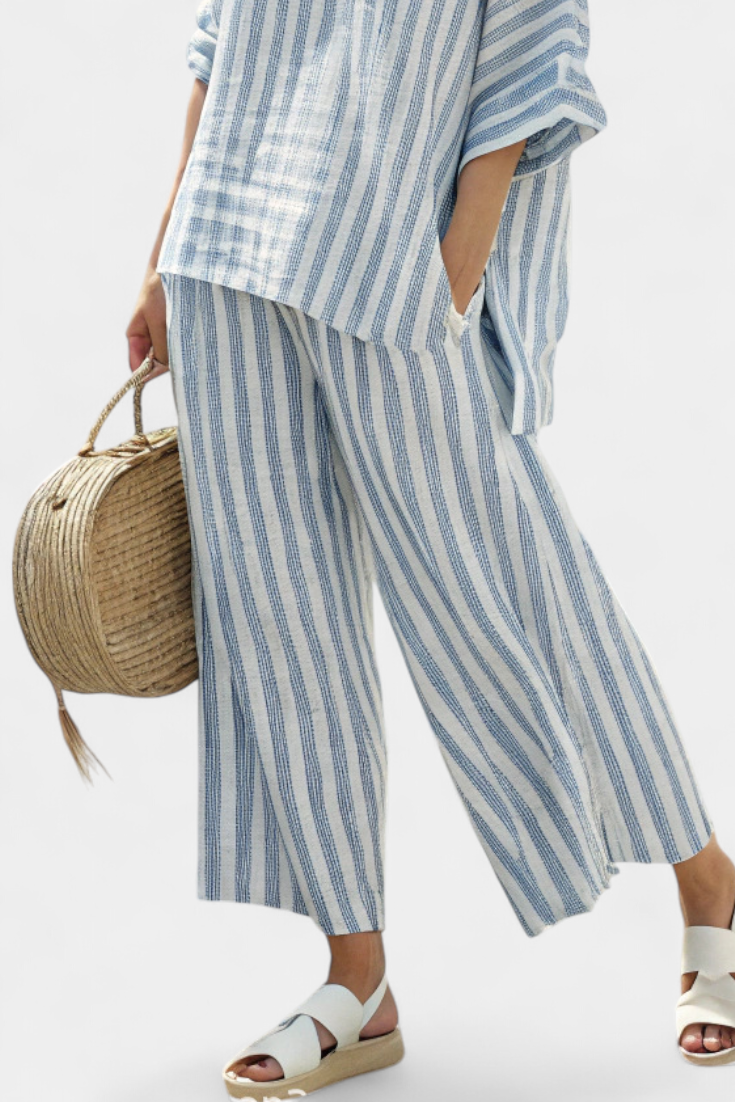 Chic women's co-ord set featuring a striped top and wide leg pants, ideal for summer fashion & travel.