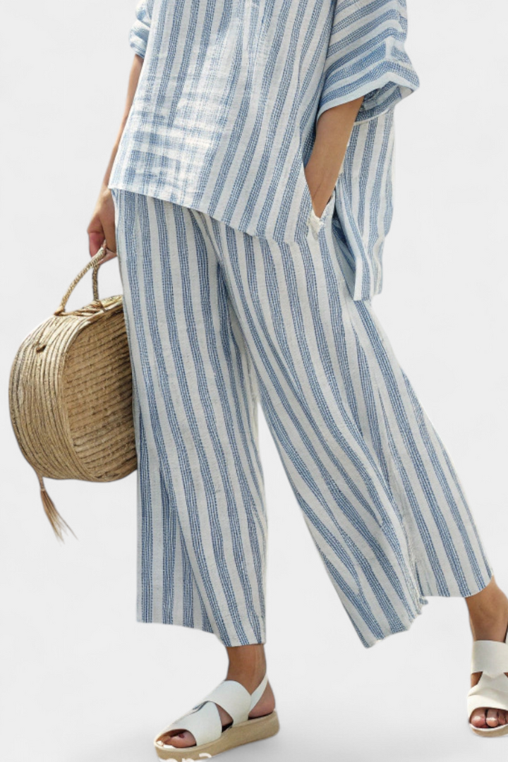 Chic women's co-ord set featuring a striped top and wide leg pants, ideal for summer fashion & travel.