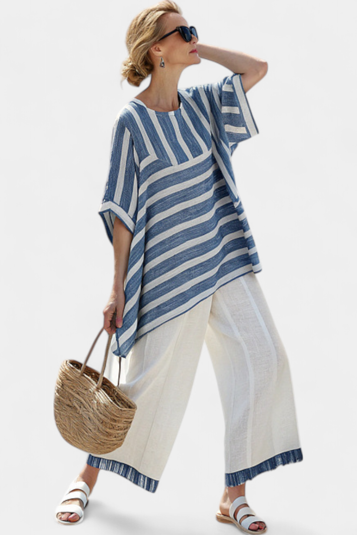 Comfortable women's summer set: striped batwing top and wide-leg trousers with an asymmetric hem, versatile.