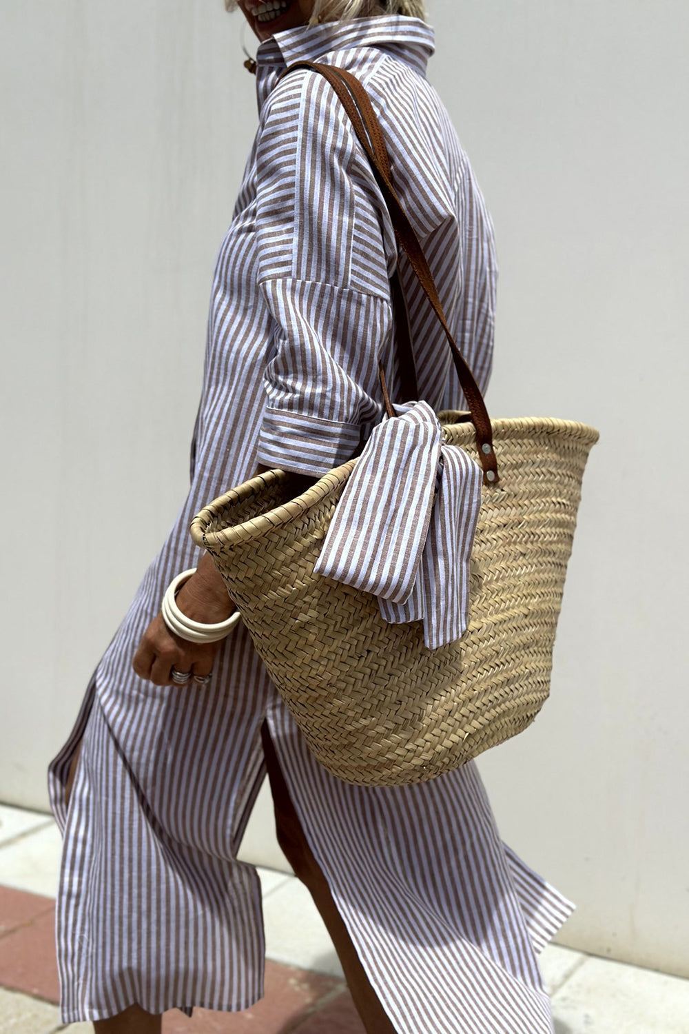 Flowy women's striped midi dress, button-down collared design offering versatile beach & day wear style.