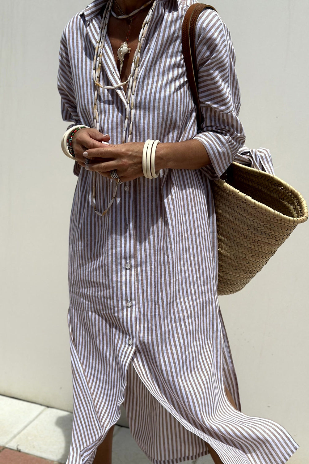 Elegant yet casual women's collared button-down midi dress, showcasing a timeless striped print & oversized fit.