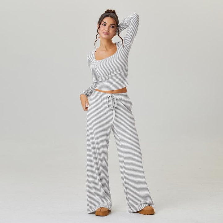 Versatile women's apparel: a striped jersey lounge set with a square neck top and wide-leg pants for ultimate comfort.