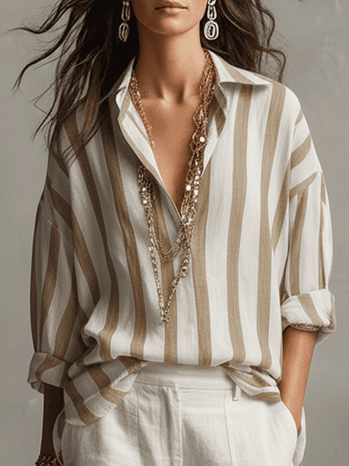 Stylish women's striped top featuring a button front and long sleeves for a versatile, relaxed fit look.