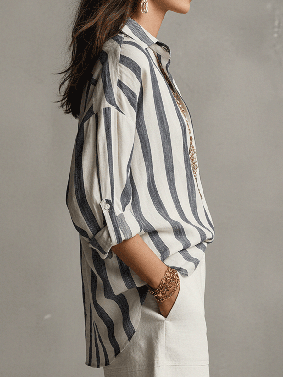Modern women's striped blouse, relaxed fit, with long sleeves and a stylish button-front design.