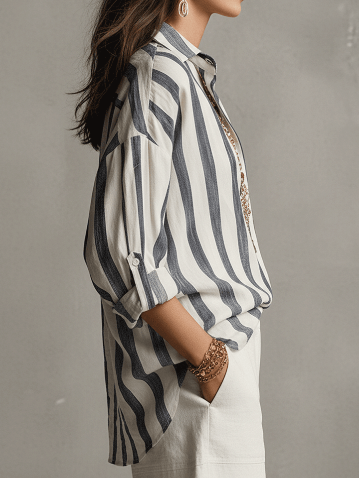 Modern women's striped blouse, relaxed fit, with long sleeves and a stylish button-front design.