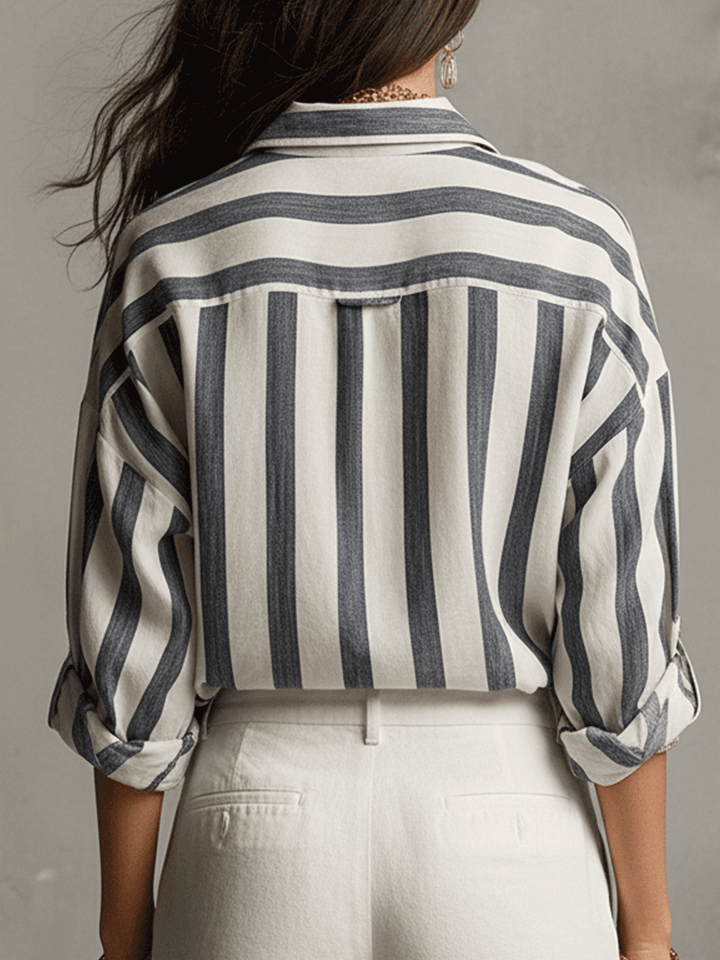 Front view of a women's striped long sleeve blouse, buttoned down, showcasing its elegant casual appeal.