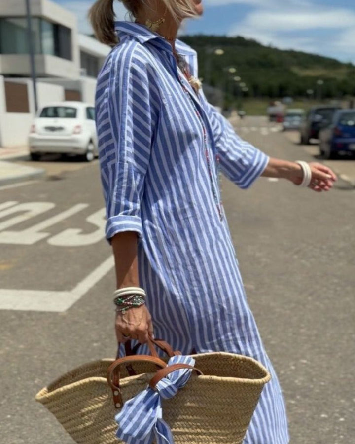 Comfortable striped midi shirt dress for women, featuring a full button-down front and practical side pockets.